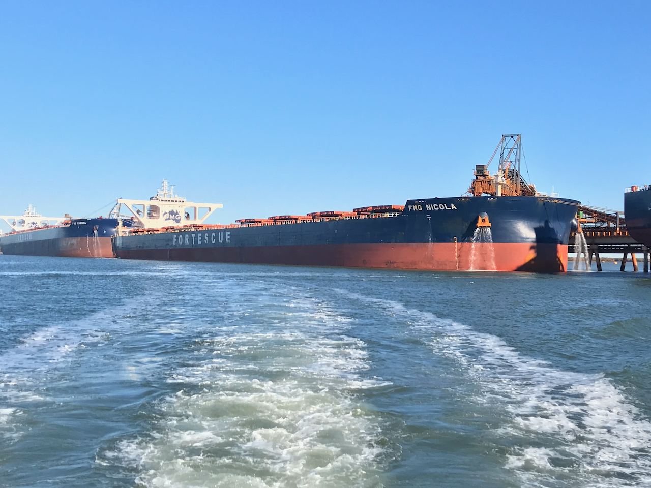 The Fortescue bulk carrier FMG Nicola alongside at an iron ore loading berth